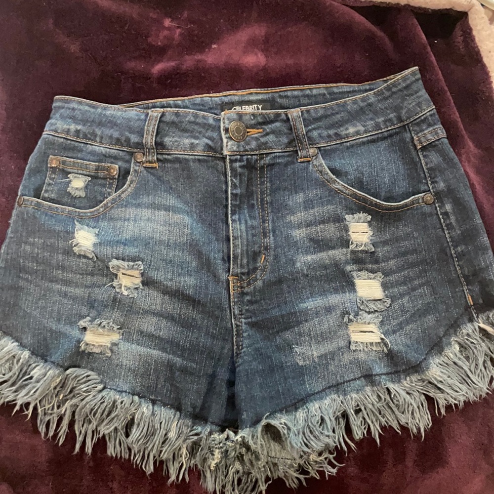 Celebrity pink denim jean shorts with fringe